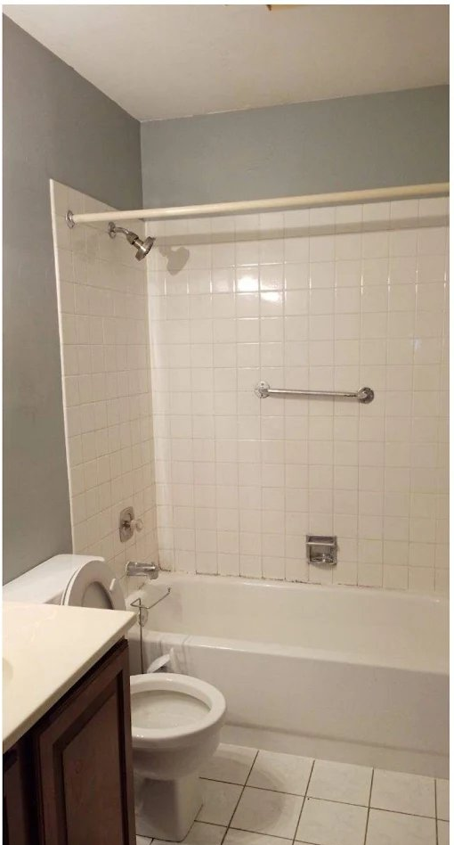 Commercial restroom tile and tub restored to white