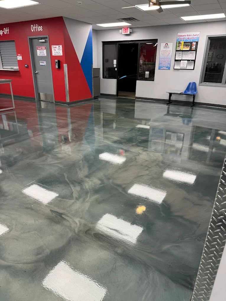 Same facility after strip and wax: mirror-gloss finish reflecting the ceiling lights